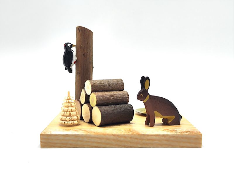 Kerzenhalter mit Hase und Specht